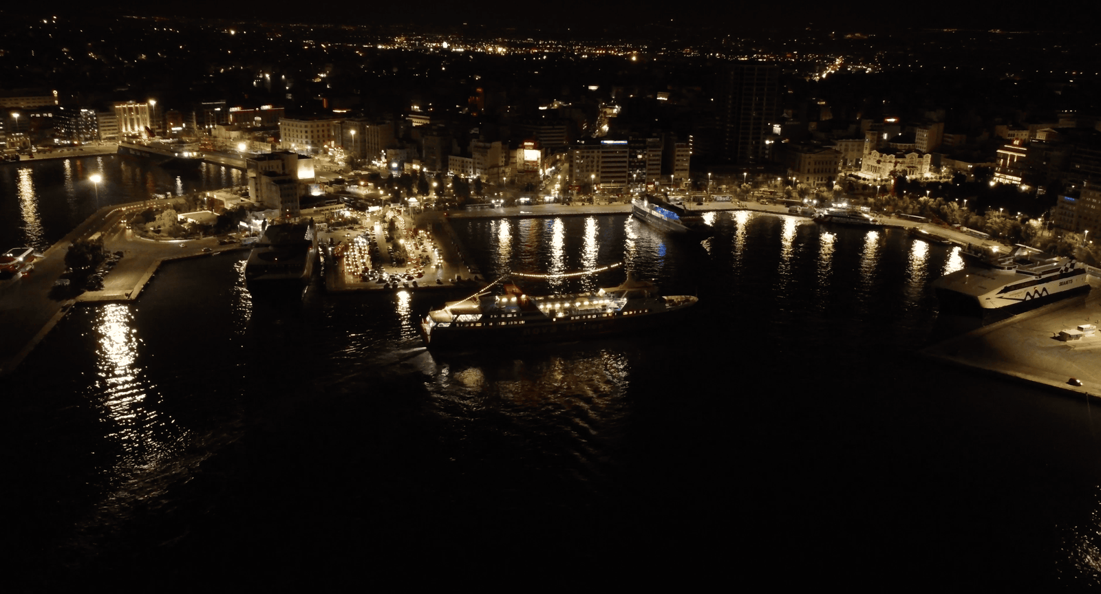 Ferry From Athens To Mykonos: Best Travel Mode Or Not? 3 Piraeus harbor in Athens by night