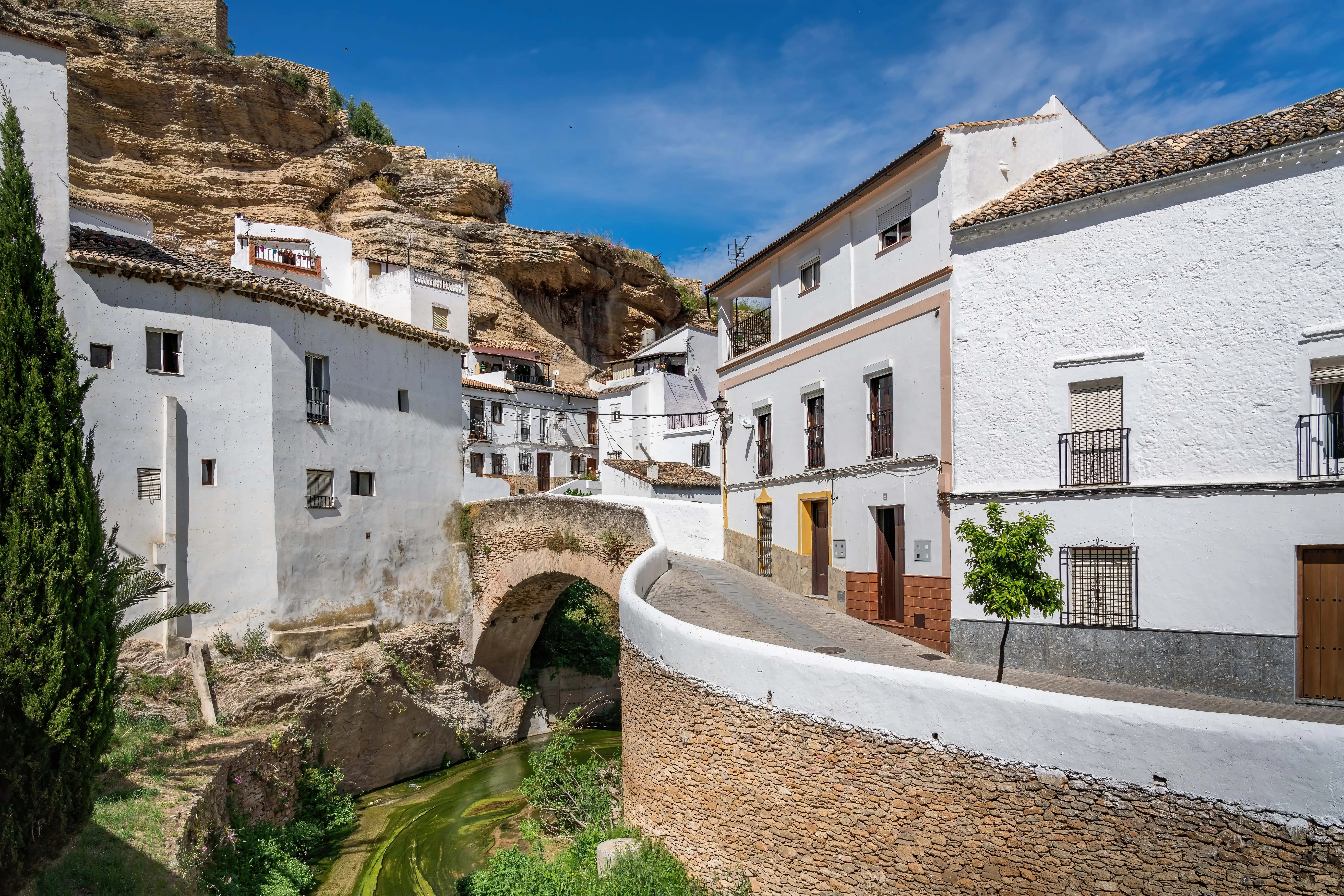 Bridge over Trejo River and rock overhangs Setenil de las Bodegas, Andalusia, Spain