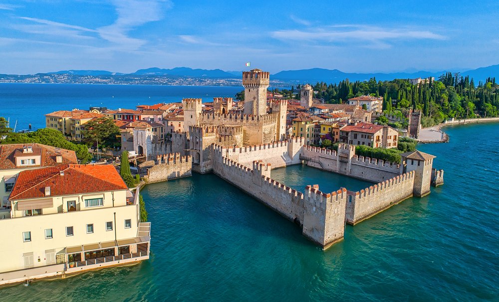 Limone sul Garda Guide: Things to Do, Food & Itinerary 11 Aerial view to the town of Sirmione, popular travel destination on Lake Garda in Italy