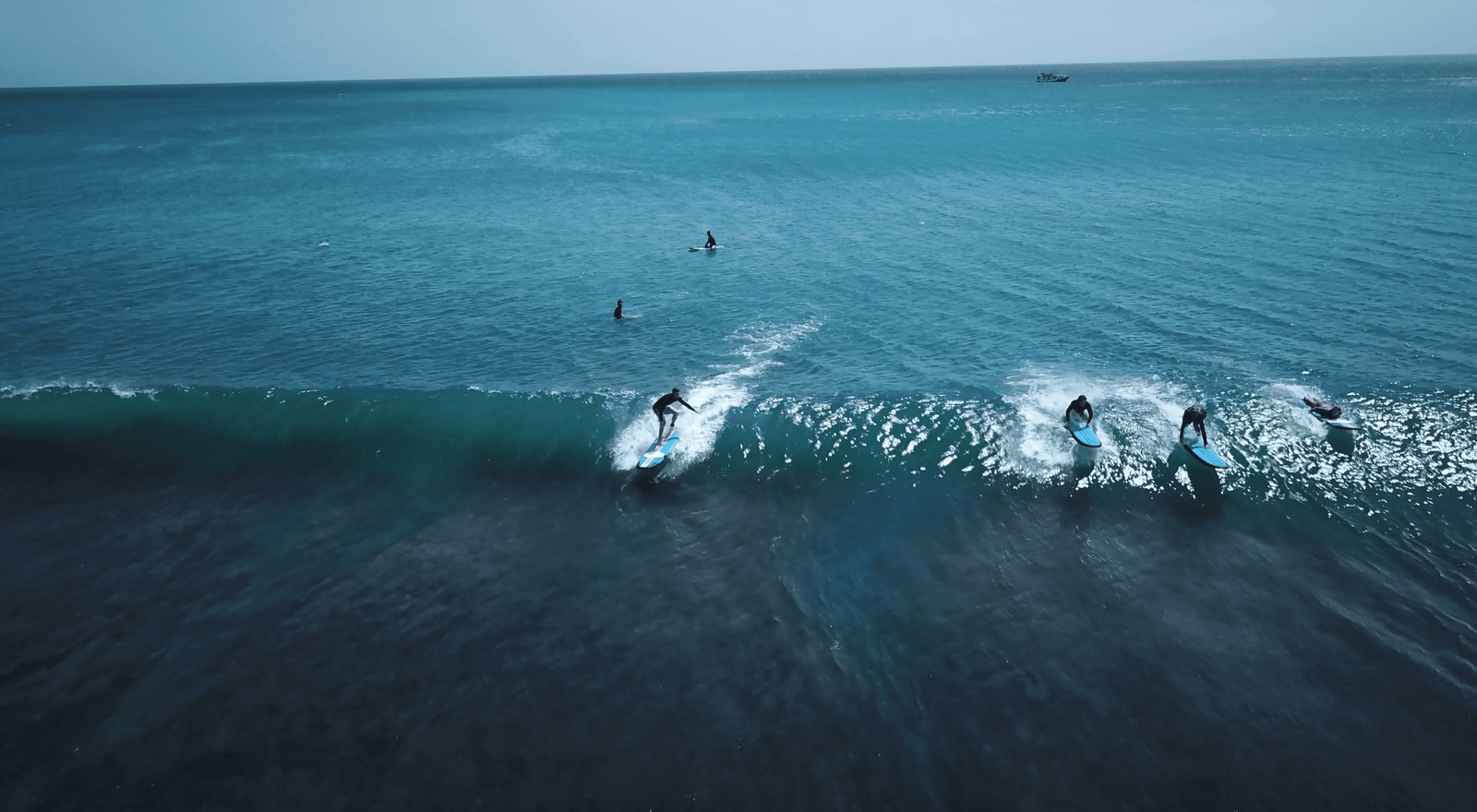 20 Fun Tips to Visit Padang Padang Beach Uluwatu 3 Drone shot of surfers in Padang Padang