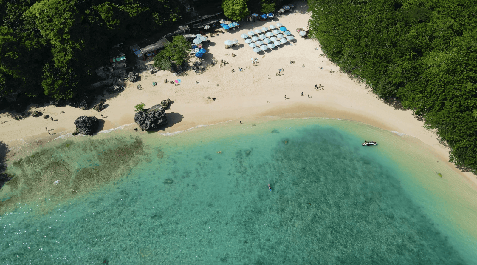 20 Fun Tips to Visit Padang Padang Beach Uluwatu 7 sky view of Padang Padang beach in Bali, with surfers in the water
