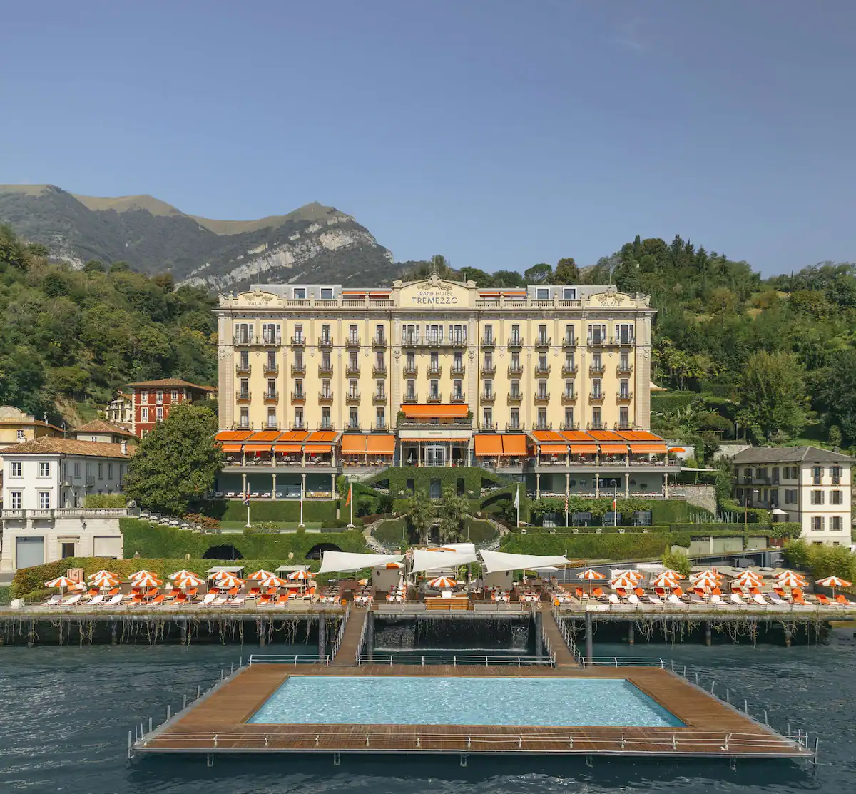 Luxury hotel infront of Lake como with a pool floating over the lake
