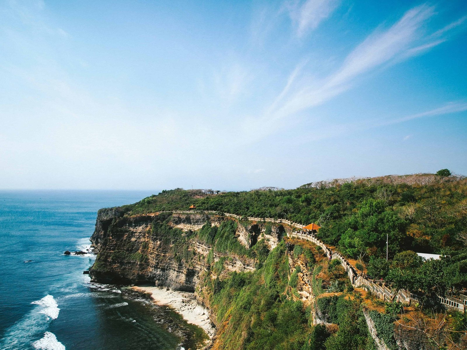 First Timer's Guide to Uluwatu Temple In Bali (2026) 10 Paved pathway next to the cliff