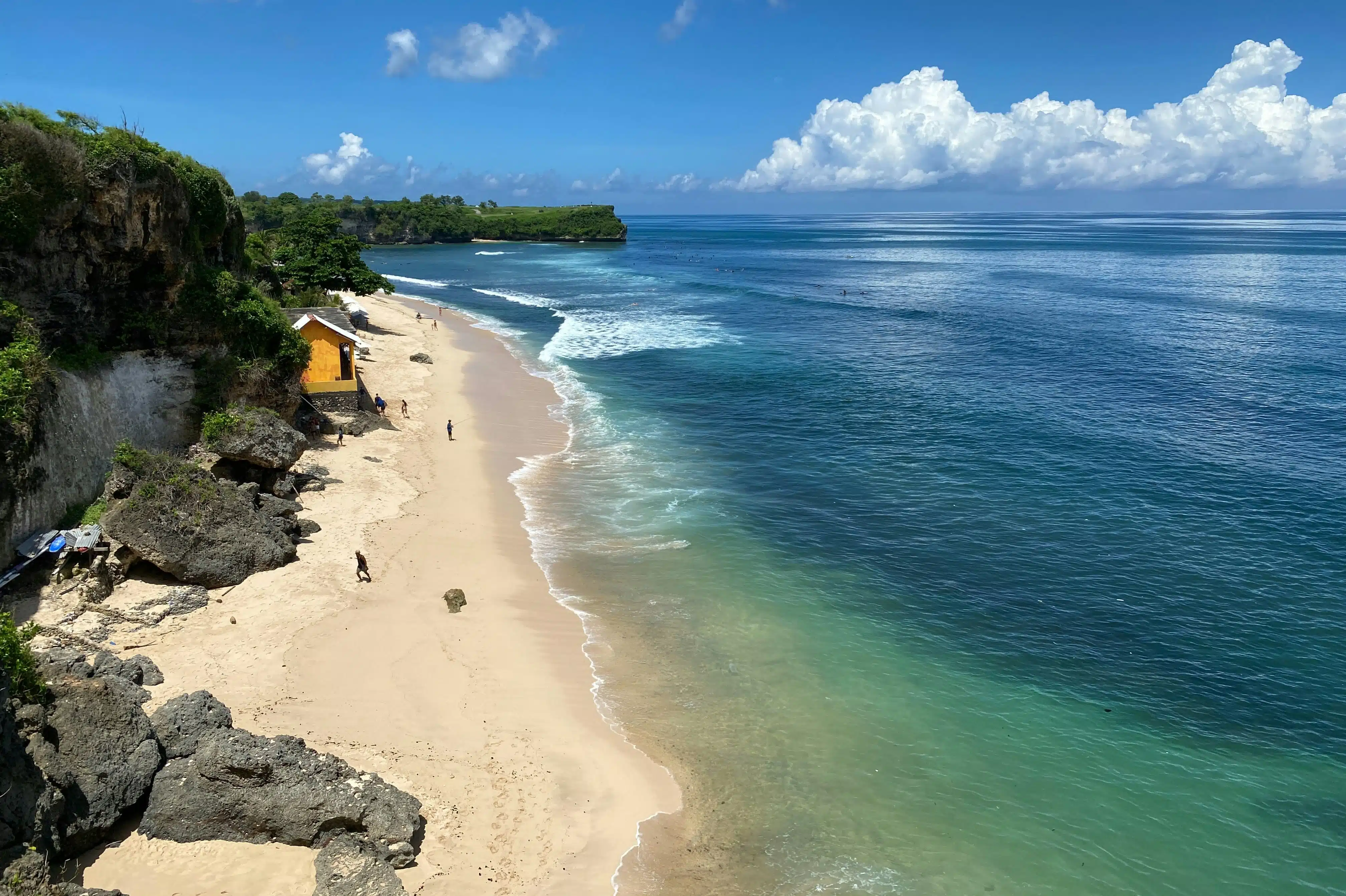 Uluwatu Beach underneath Uluwatu Temple