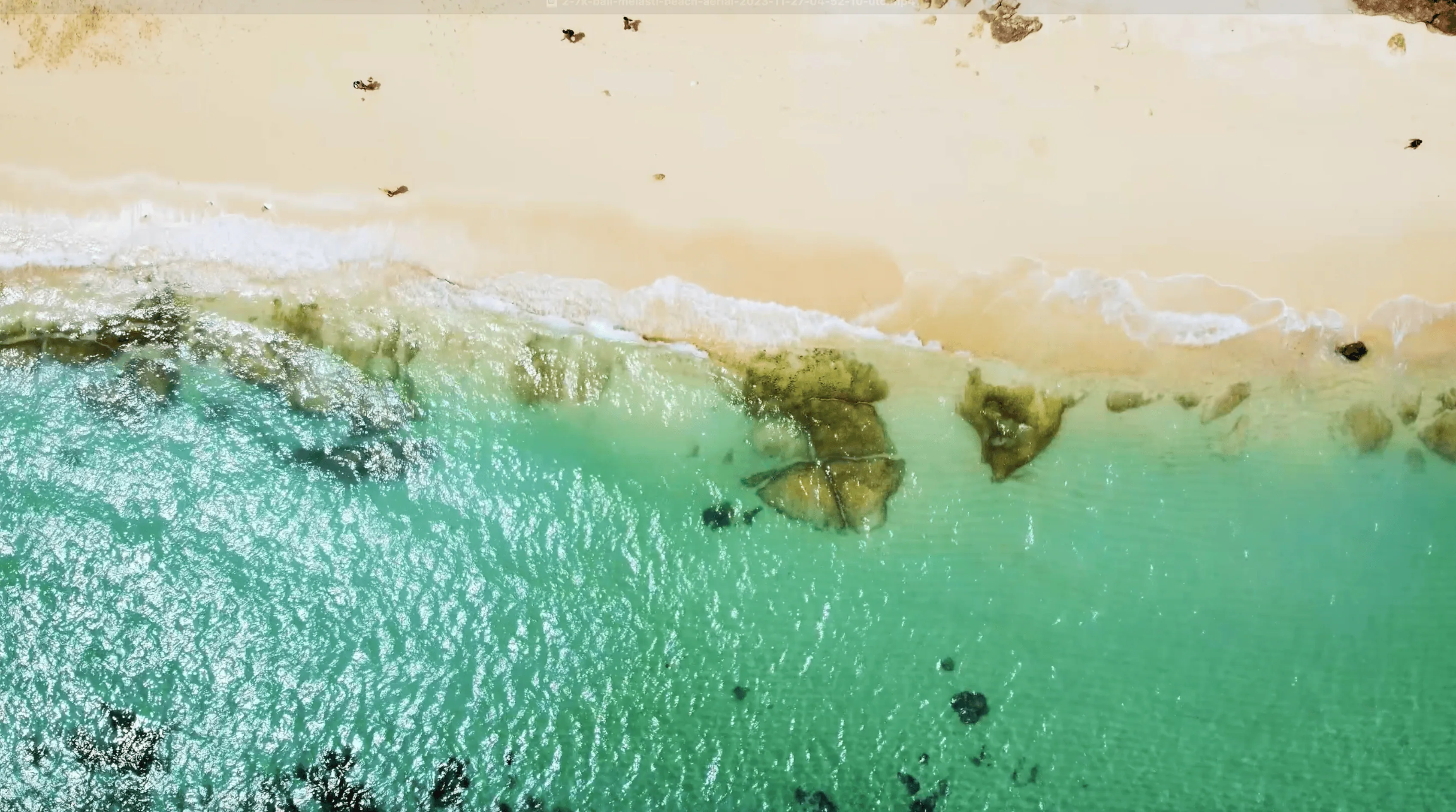 Crystal clear water at Melasti Beach