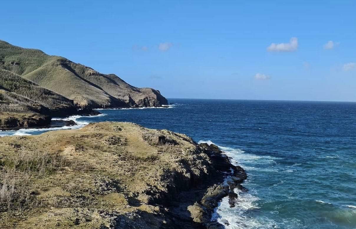 Ua Pou Marquesas Islands: A Full Guide For First-Timers 11 a rocky coast with waves crashing on the shore in Ua Pou