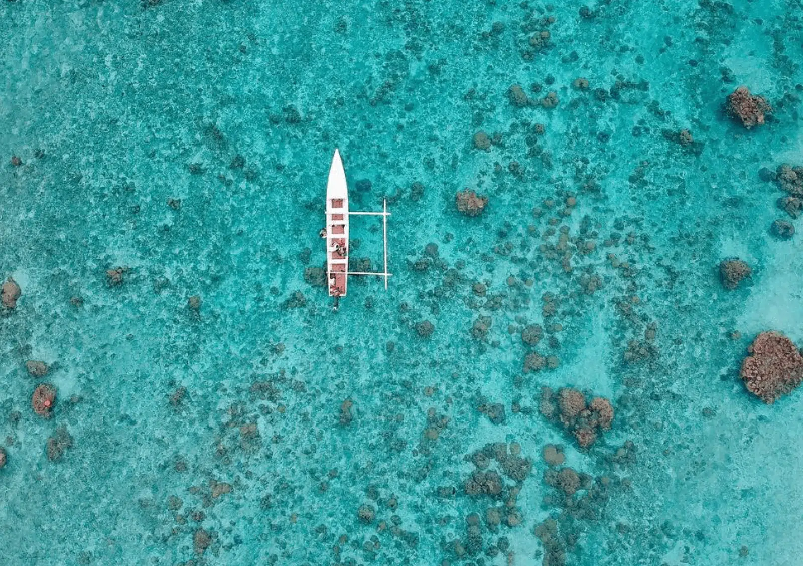 Vahine island canoe on the blue lagoon.
