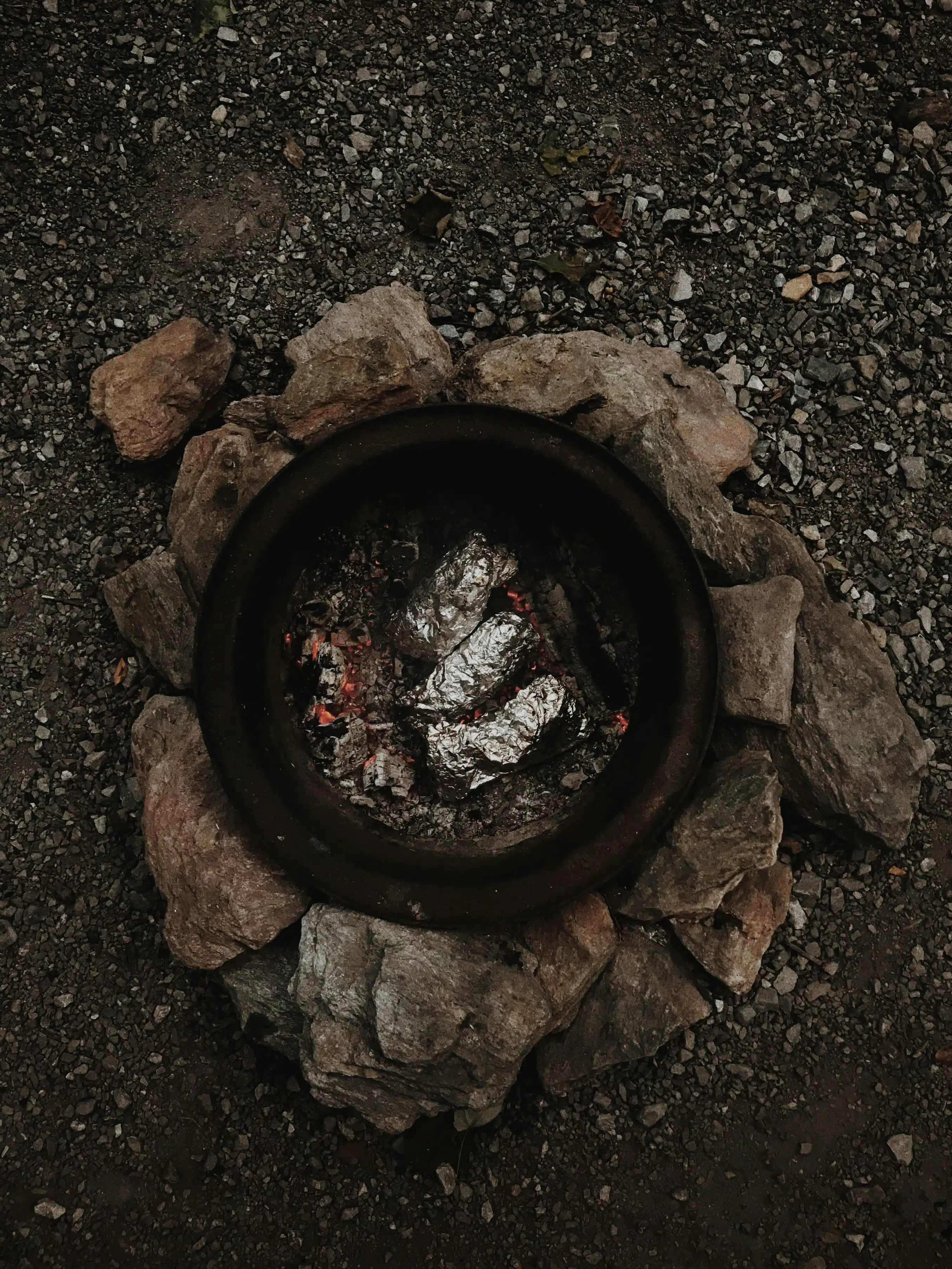 Hole in the ground. Normally covered with leaves and rocks so the heat stays within.