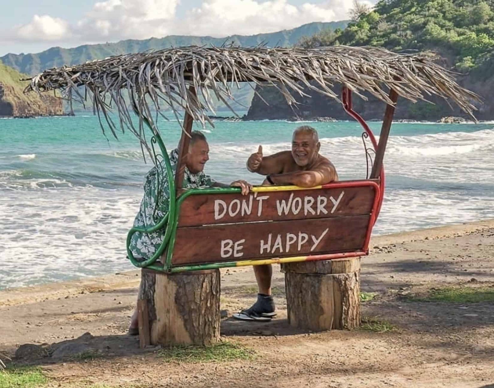 Why Visit Hiva Oa Island (TOP Things to do + Itinerary)! 14 Two men sitting on a bench on a beach