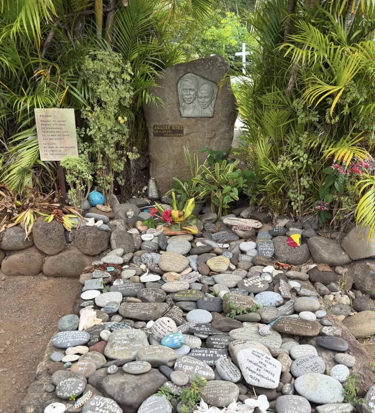 a rock with writing on it from Jacques Brel
