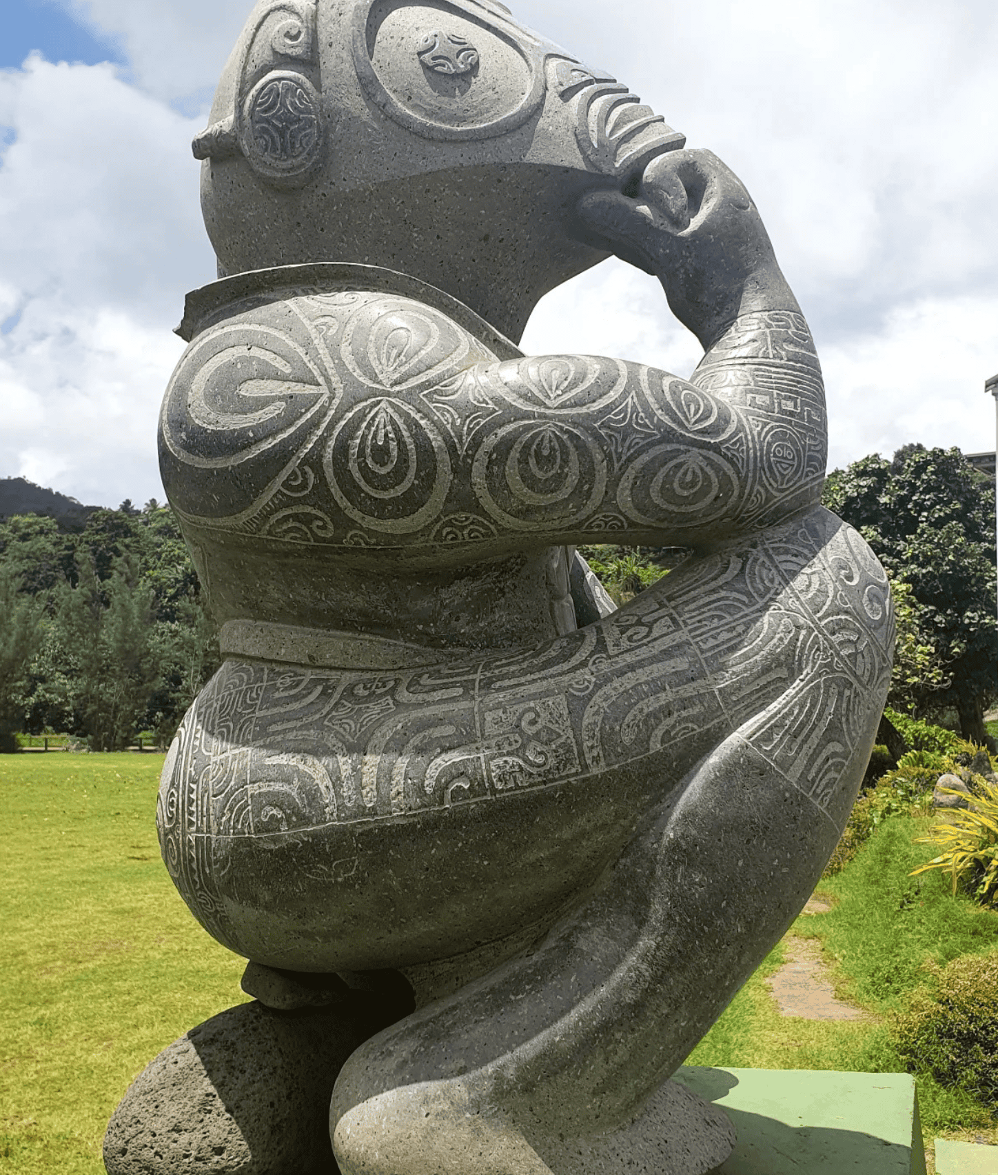 Why Visit Hiva Oa Island (TOP Things to do + Itinerary)! 3 a statue of a person holding his head