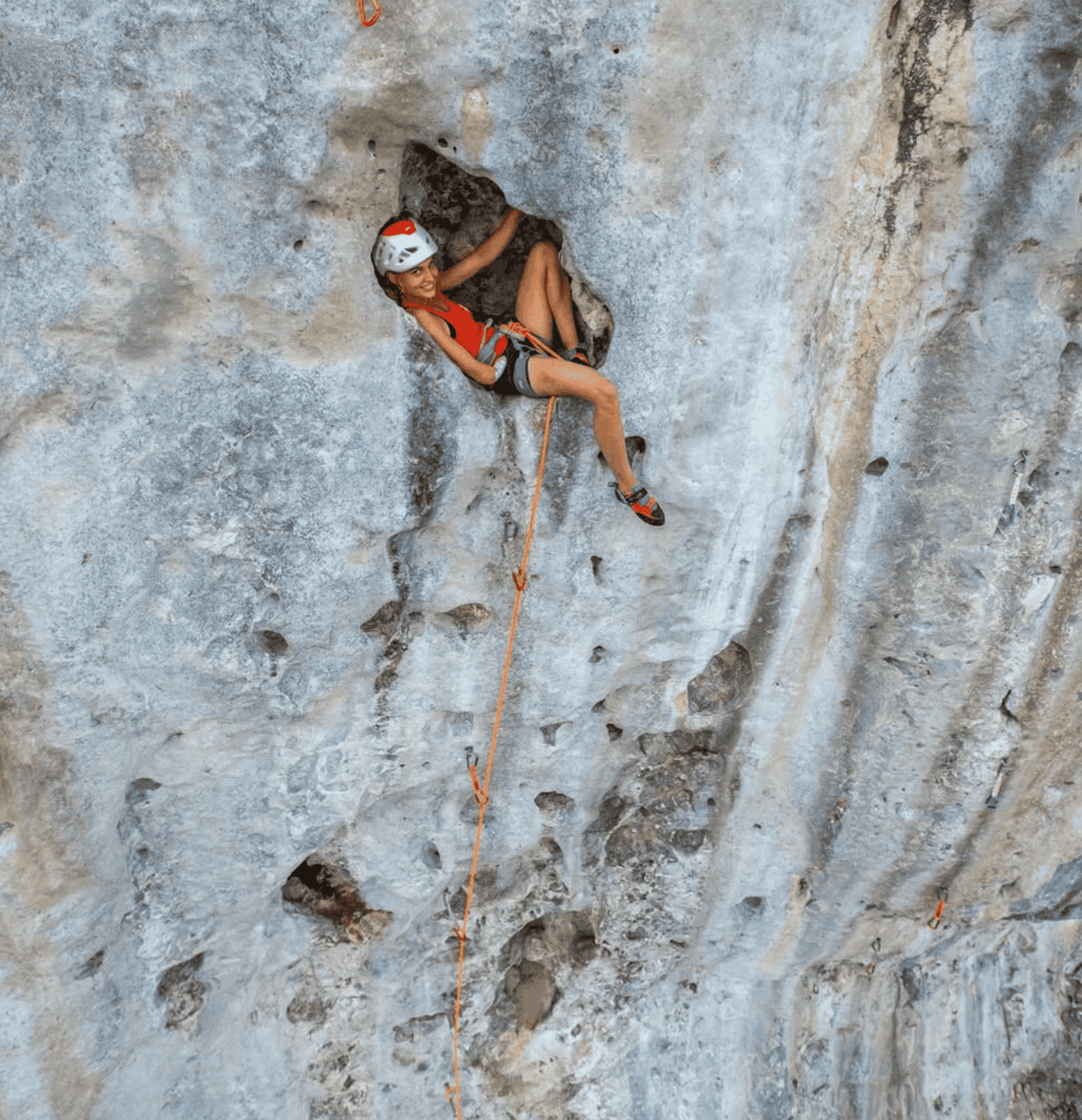 Makatea Island: The Complete Travel Guide (With Map)! 7 a woman climbing a rock wall at Makatea Tahiti