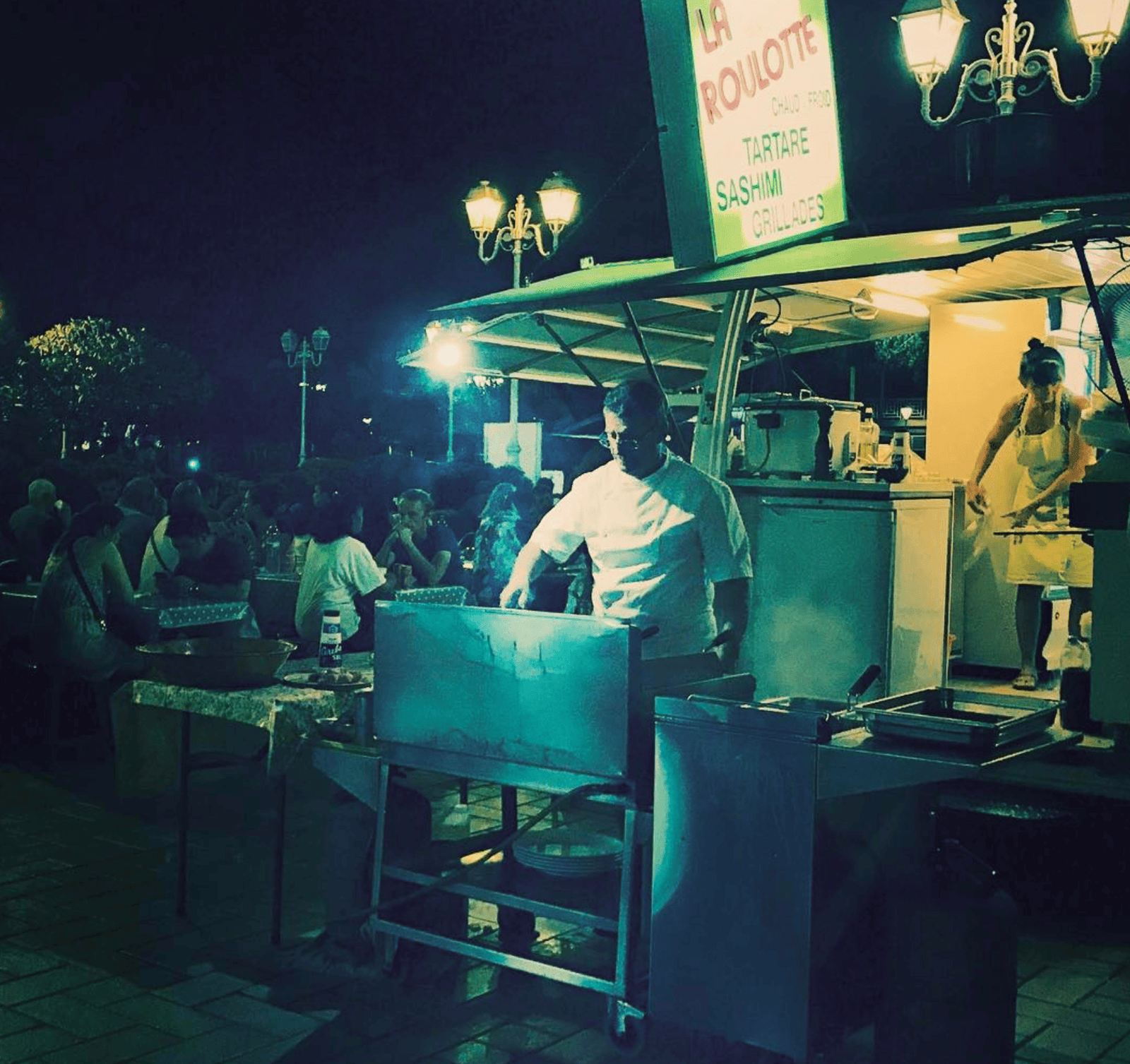 Bora Bora Honeymoon: Best Places To Stay + Activities 12 A food truck with a stand in Tahiti.