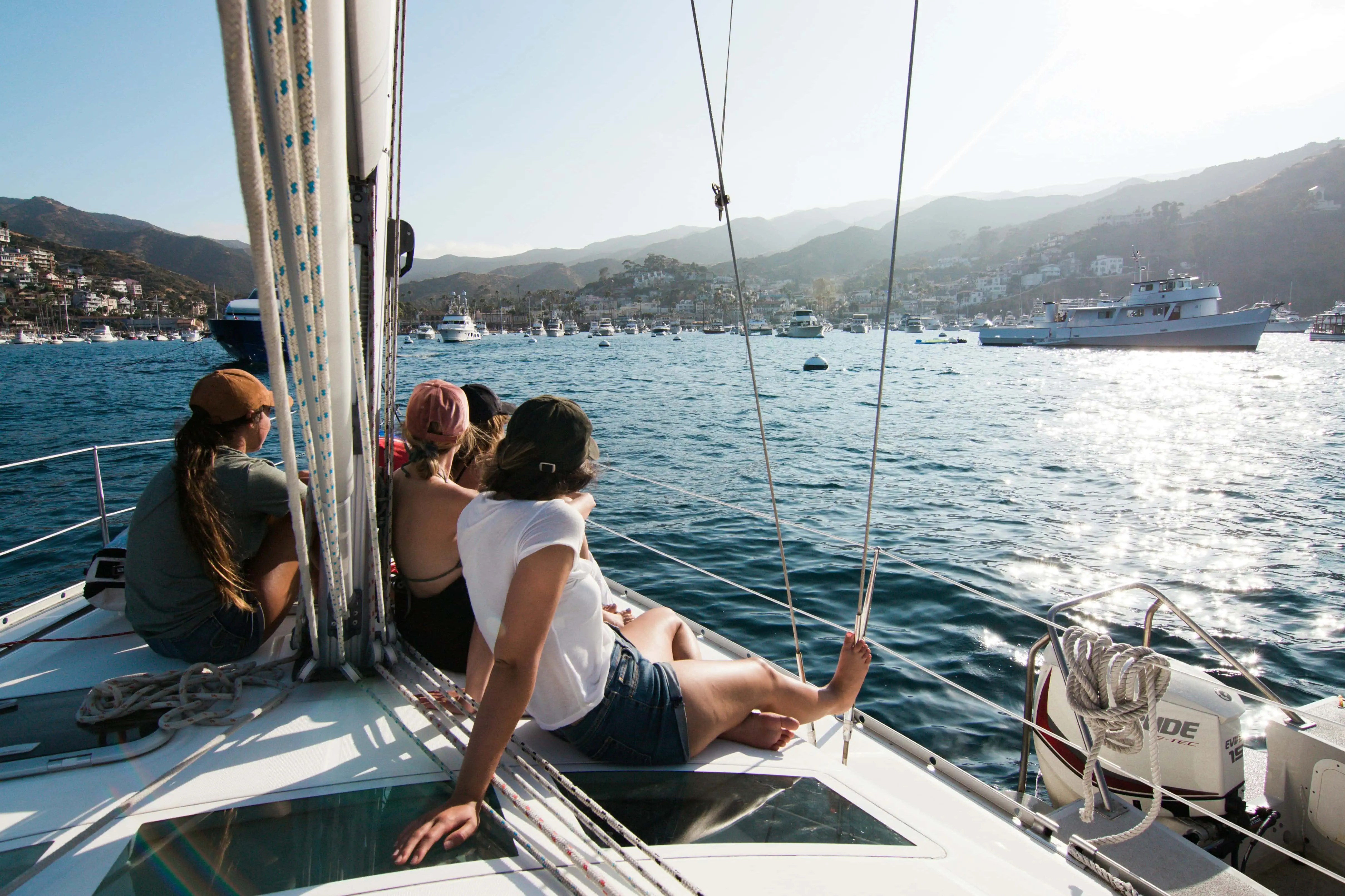 People enjoying the boat on a sunny day in a bay