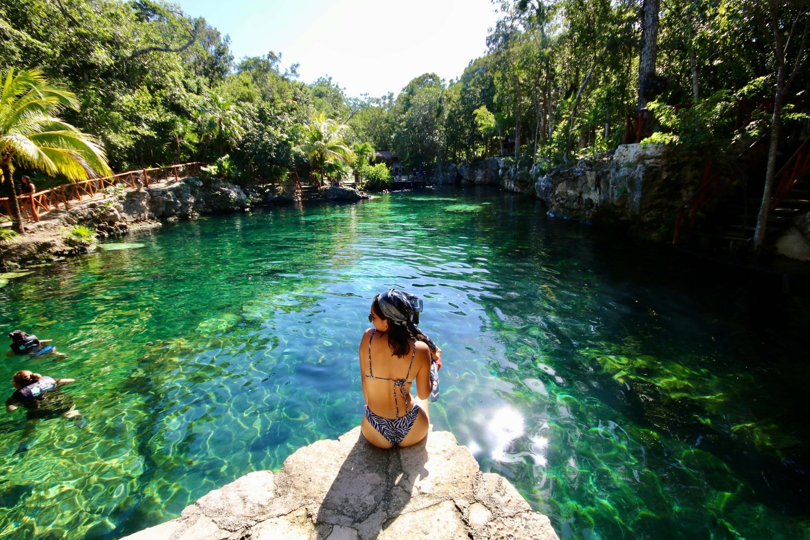 Woman relaxing at Cenote tortuga in Tulum