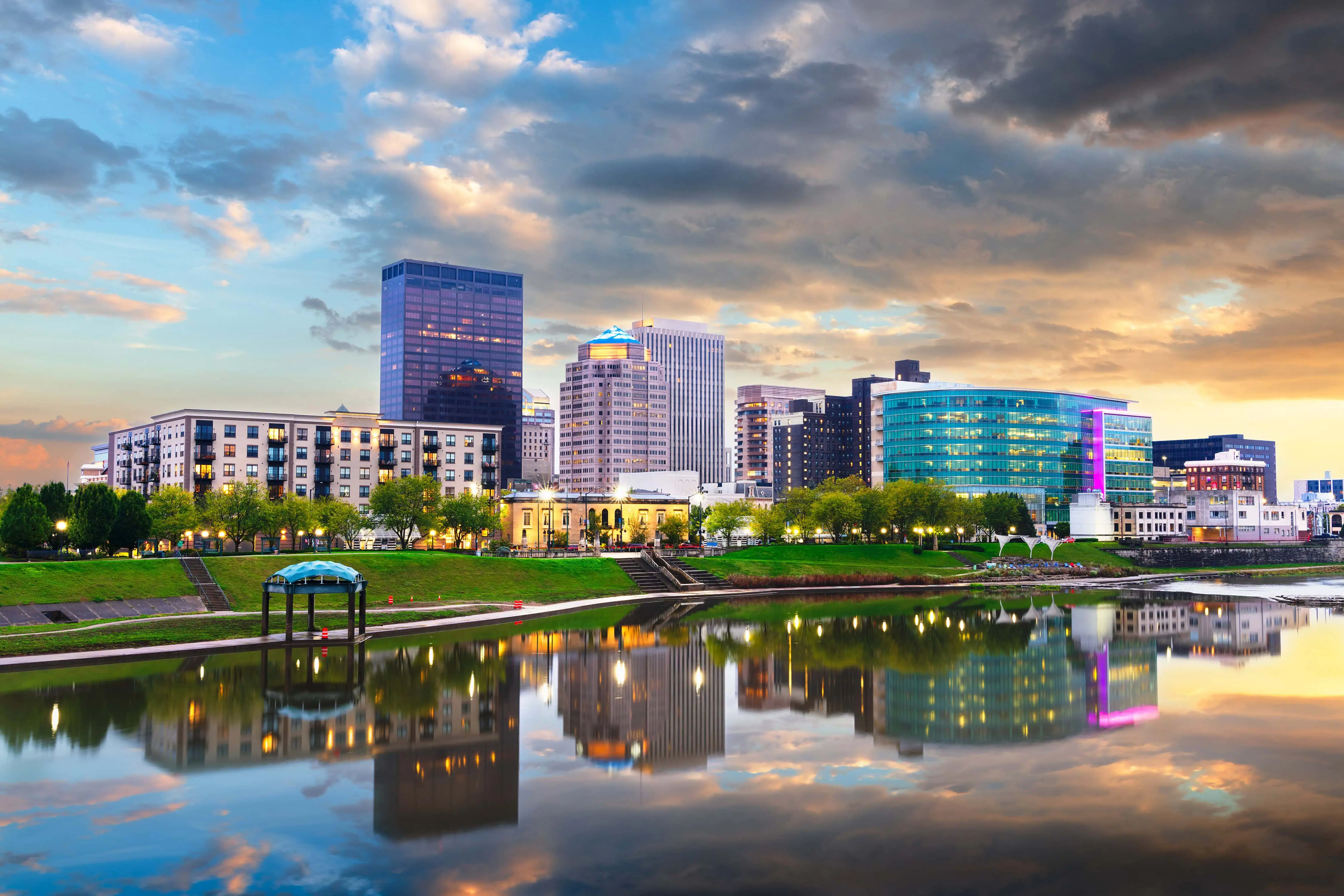 Dayton, Ohio, USA downtown cityscape on the Miami River at dusk.