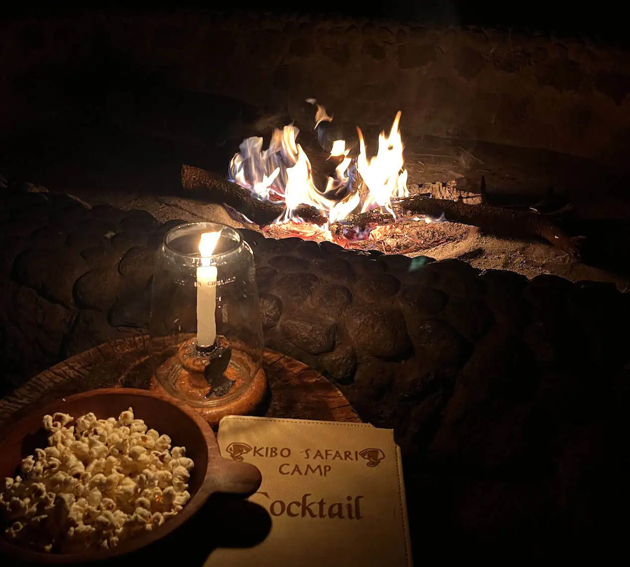 Sitting at a campfire at Kibo Safari Camp