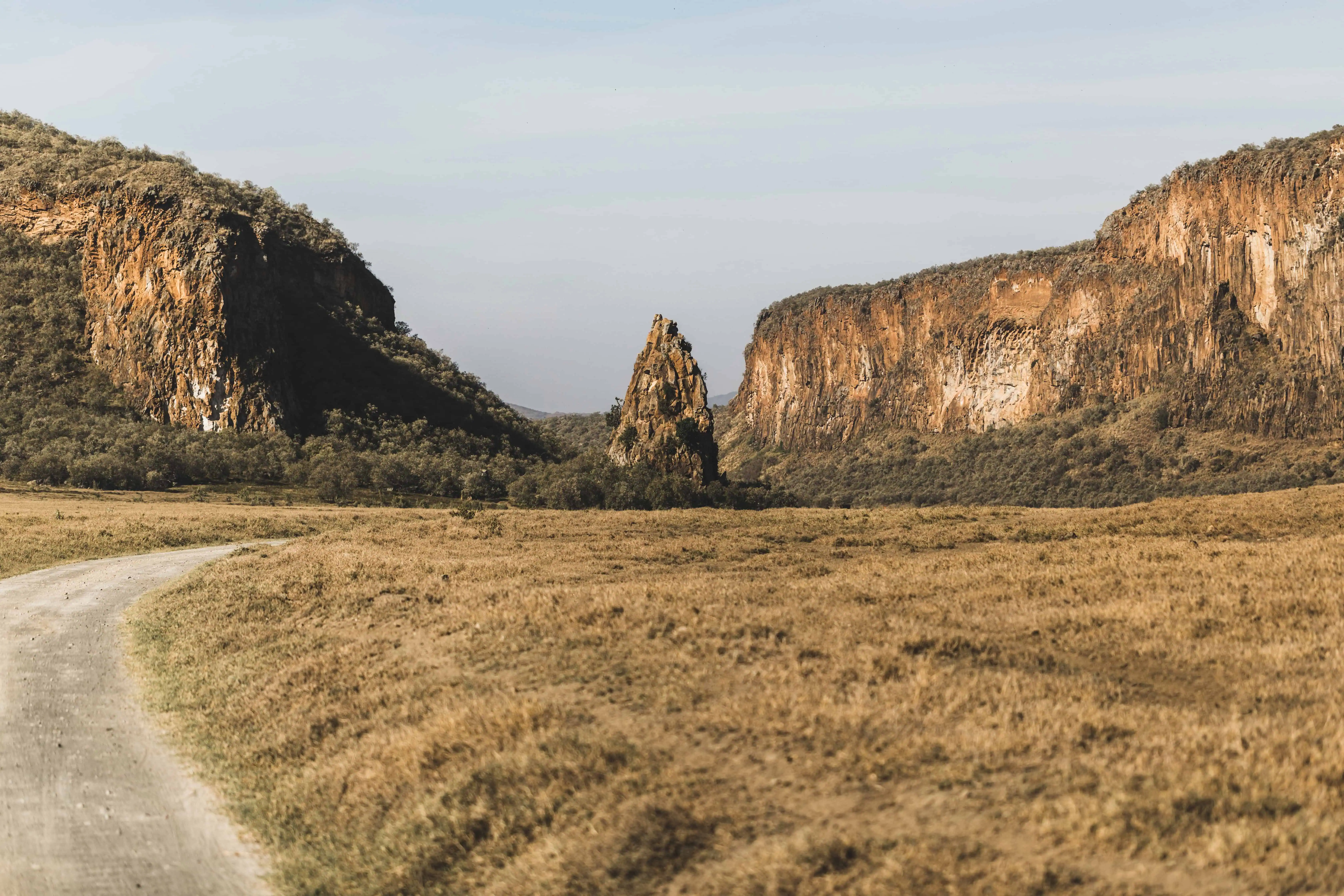 Safari in Hell's Gate national park in Kenya. Basalt mountain and rock, main landmark. Explore wilderness of Africa.