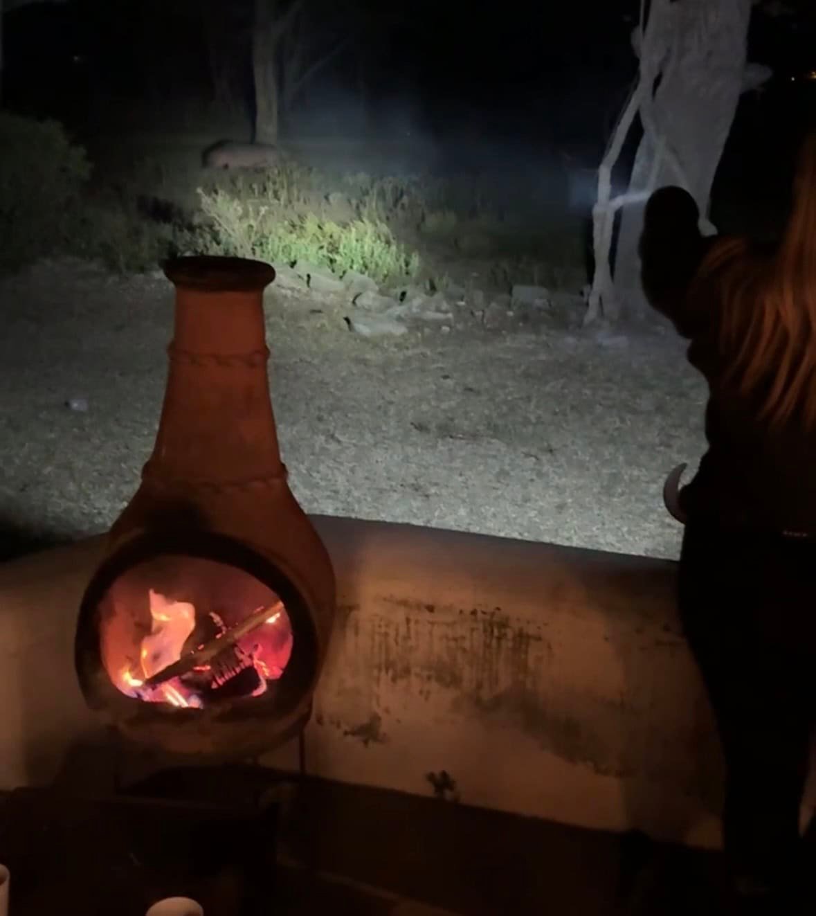 Naivasha in Kenya Travel Guide (With Itinerary and Tips) for 2026! 10 A cozy outdoor nighttime scene with a clay fireplace, warm fire burning, and a person enjoying the peaceful surroundings of nature. Perfect for reflecting and relaxing in a tranquil, rustic setting.