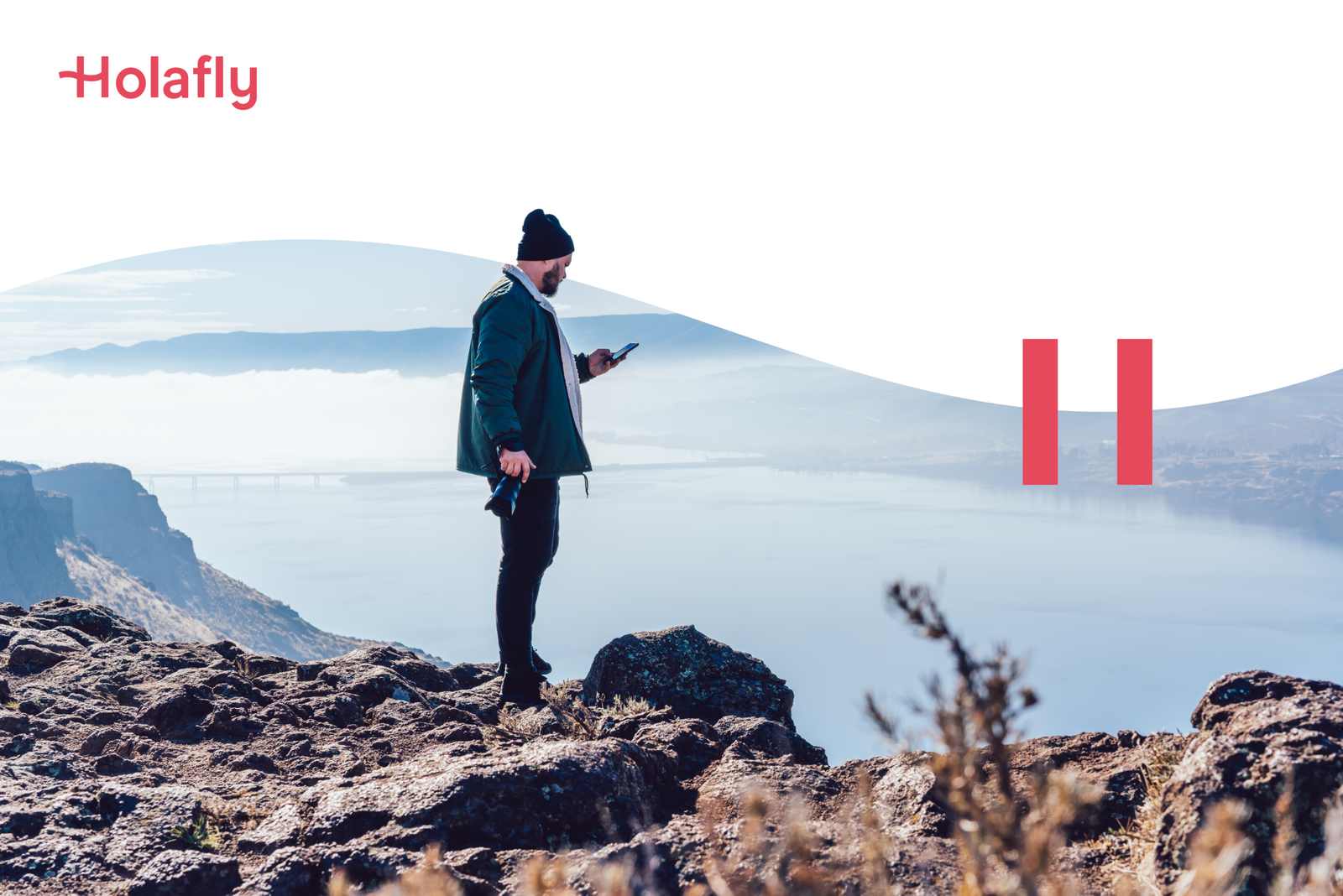 Best eSIM for International Travel (Unlimited Data + No Roaming Fees) 8 Holafly promotion, person overlooking a lake